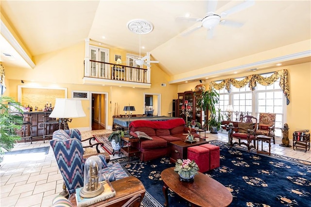 tiled living area featuring ceiling fan and high vaulted ceiling