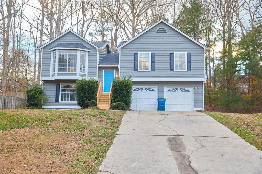 split foyer home featuring a garage