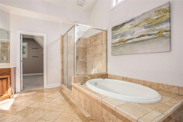 bathroom featuring tile patterned floors, vanity, independent shower and bath, and vaulted ceiling