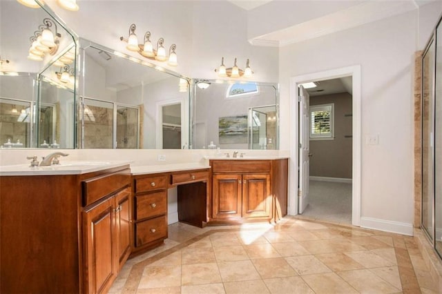 bathroom with tile patterned flooring, vanity, and walk in shower