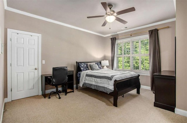 bedroom featuring ceiling fan, light colored carpet, and crown molding