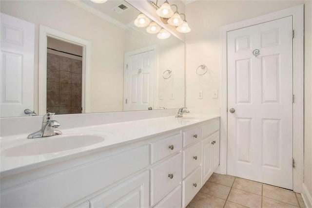 bathroom featuring tile patterned flooring and vanity