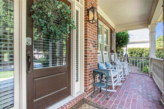 property entrance featuring covered porch