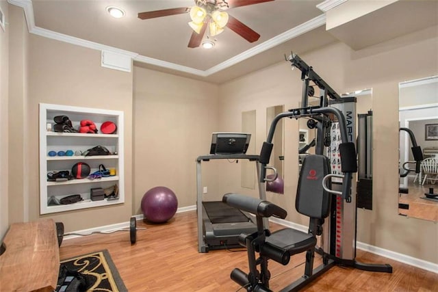 exercise room with hardwood / wood-style floors, ceiling fan, and crown molding