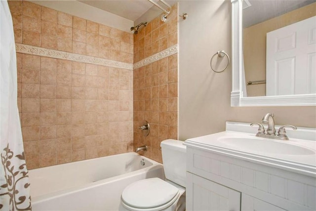 full bathroom with vanity, shower / tub combo, and toilet