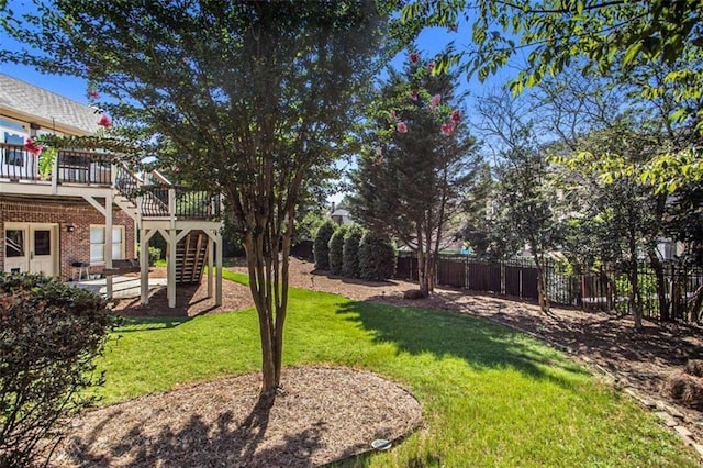 view of yard with a wooden deck