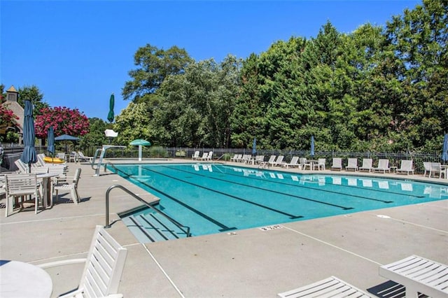 view of swimming pool featuring a patio