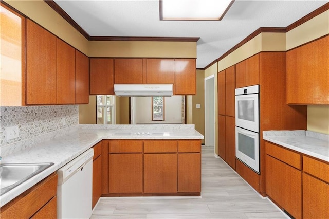 342 Spring Valley Rd, Waynesboro, GA 30830 - kitchen with white appliances, crown molding, a sink, and brown cabinetry