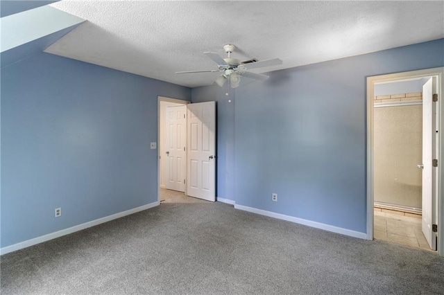 342 Spring Valley Rd, Waynesboro, GA 30830 - unfurnished bedroom featuring carpet flooring, baseboards, a textured ceiling, and a ceiling fan