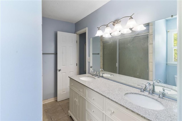 342 Spring Valley Rd, Waynesboro, GA 30830 - full bathroom featuring tile patterned flooring, double vanity, baseboards, and toilet