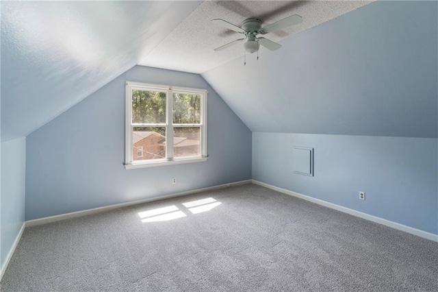 342 Spring Valley Rd, Waynesboro, GA 30830 - additional living space featuring carpet, vaulted ceiling, a textured ceiling, baseboards, and ceiling fan