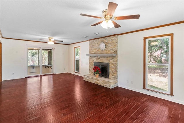 342 Spring Valley Rd, Waynesboro, GA 30830 - unfurnished living room with a ceiling fan, wood finished floors, a stone fireplace, baseboards, and ornamental molding