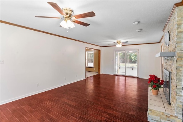 342 Spring Valley Rd, Waynesboro, GA 30830 - unfurnished living room featuring ceiling fan, ornamental molding, a stone fireplace, wood finished floors, and baseboards