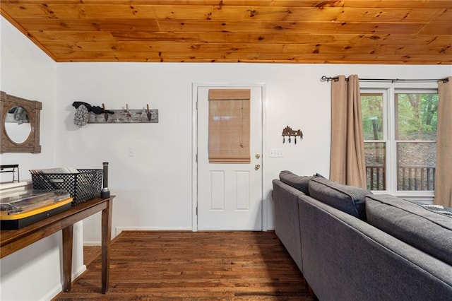 interior space with dark hardwood / wood-style floors, wood ceiling, and vaulted ceiling