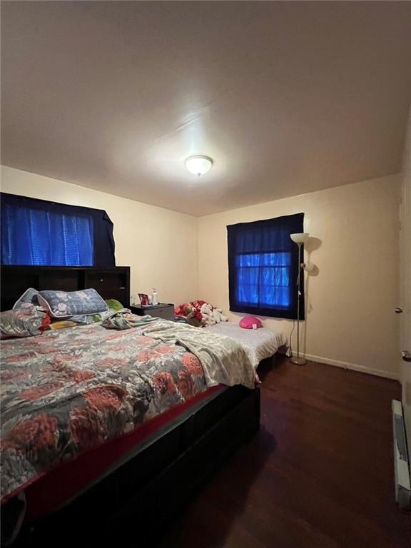 bedroom with hardwood / wood-style flooring