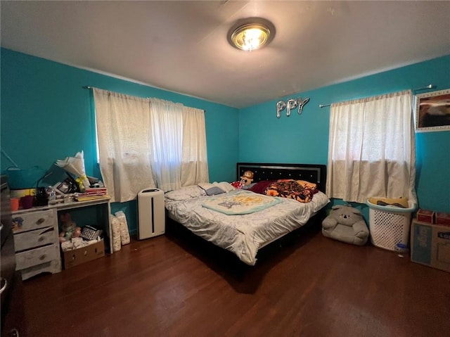 bedroom featuring dark hardwood / wood-style floors