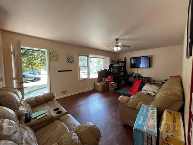 living room with ceiling fan, a healthy amount of sunlight, and dark hardwood / wood-style flooring