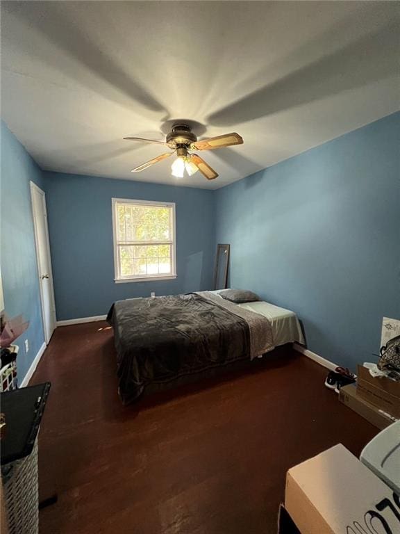 bedroom featuring dark hardwood / wood-style floors and ceiling fan