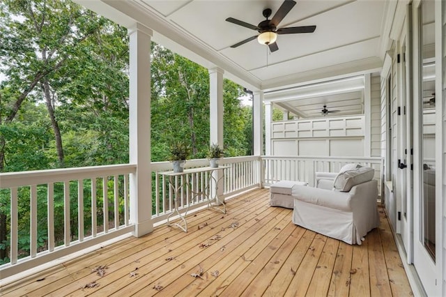 wooden terrace with a ceiling fan