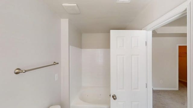 full bath featuring baseboards and a closet