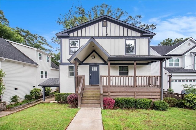 view of front facade featuring a porch, a garage, and a front lawn