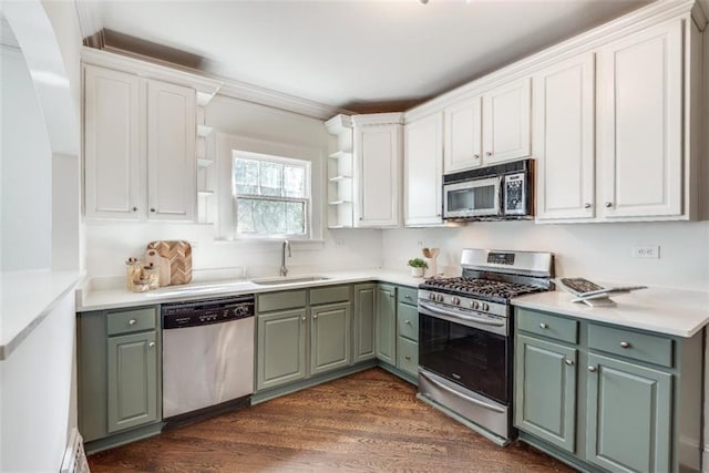 kitchen with dark wood-type flooring, stainless steel appliances, white cabinetry, open shelves, and a sink