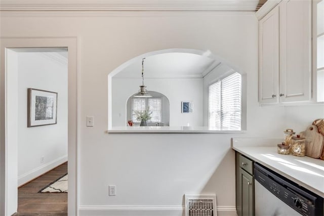 kitchen with crown molding, light countertops, visible vents, stainless steel dishwasher, and white cabinetry