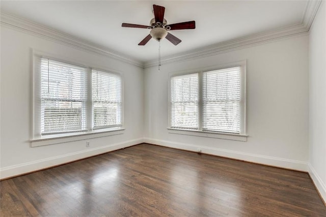 empty room featuring baseboards, ornamental molding, ceiling fan, and dark wood-type flooring