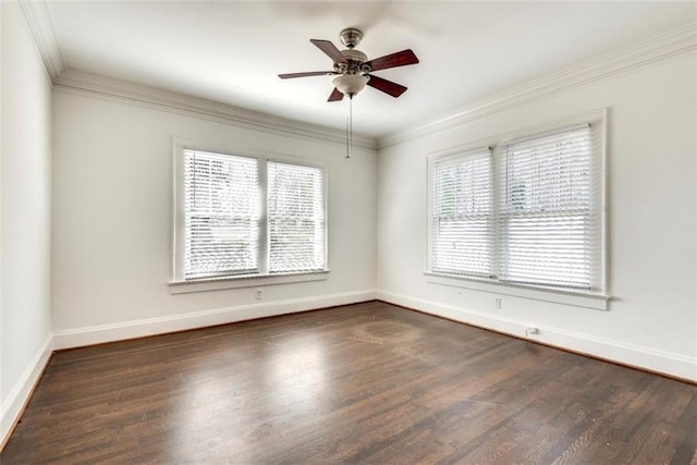 empty room featuring dark wood-style floors, ceiling fan, baseboards, and crown molding