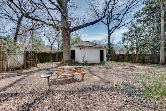 view of yard with an outbuilding and a fenced backyard