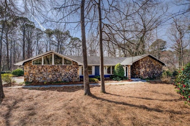 view of front of house with stone siding