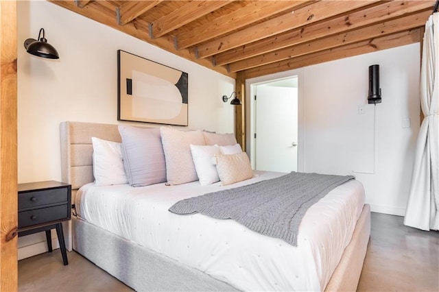 bedroom featuring concrete floors