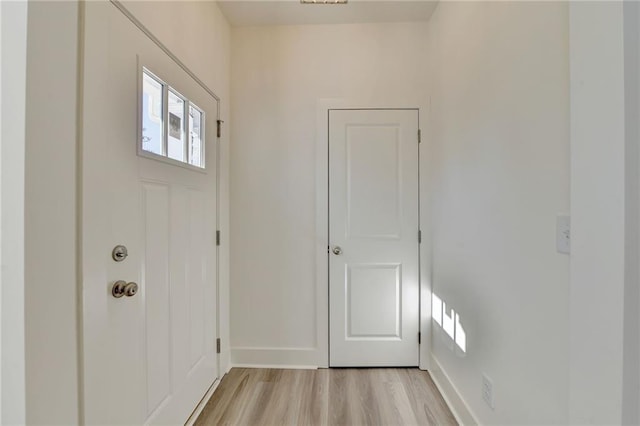 doorway to outside with light wood-type flooring