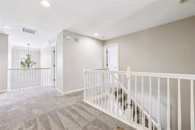 7712 Soaring Eagle Dr, Flowery Branch, GA 30542 - corridor featuring carpet flooring, baseboards, an upstairs landing, and visible vents