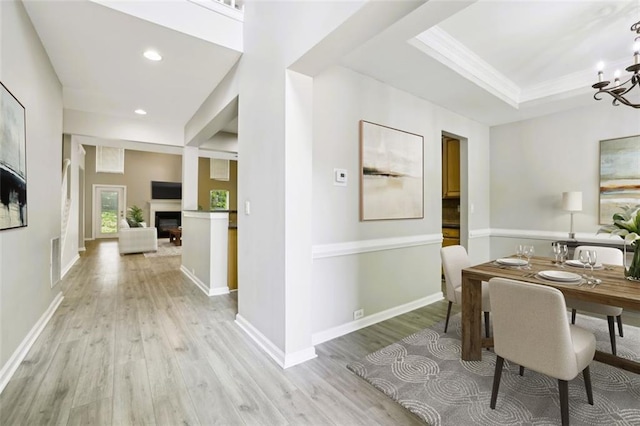 7712 Soaring Eagle Dr, Flowery Branch, GA 30542 - dining room featuring an inviting chandelier, visible vents, a fireplace, recessed lighting, and light wood-style flooring