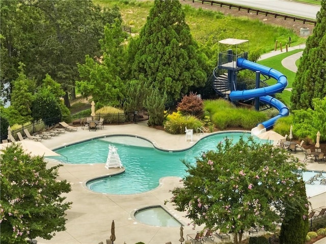 7712 Soaring Eagle Dr, Flowery Branch, GA 30542 - community pool with fence, a water slide, and a patio