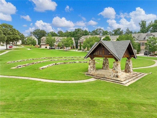 7712 Soaring Eagle Dr, Flowery Branch, GA 30542 - surrounding community with a gazebo, a lawn, and a residential view