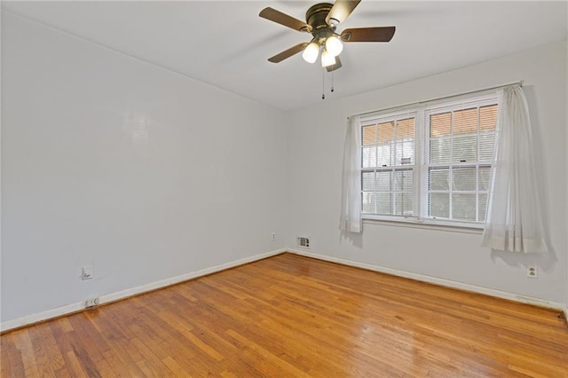 unfurnished room with ceiling fan and light hardwood / wood-style flooring