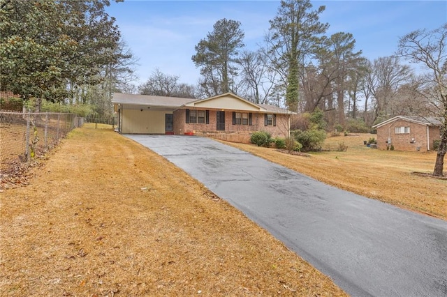 single story home with a carport and a front yard