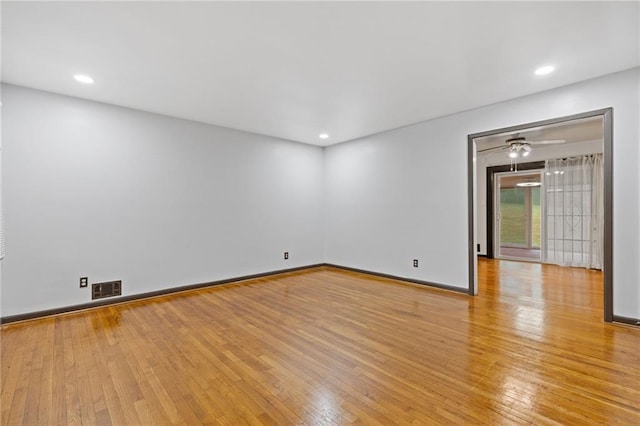 spare room featuring light wood-type flooring