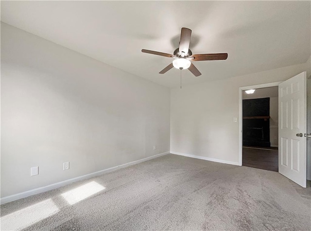 carpeted empty room with ceiling fan