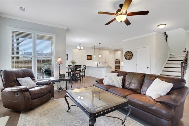 1803 Stone Bridge Way, Marietta, GA 30064 - living area with visible vents, crown molding, ceiling fan, and wood finished floors