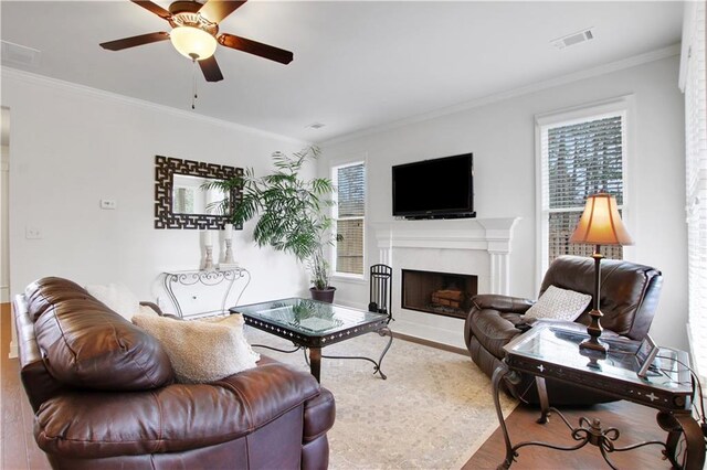 1803 Stone Bridge Way, Marietta, GA 30064 - living area with visible vents, crown molding, ceiling fan, a fireplace, and wood finished floors