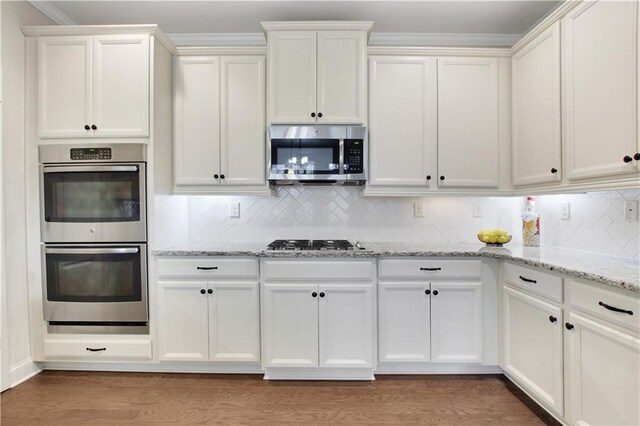 1803 Stone Bridge Way, Marietta, GA 30064 - kitchen featuring light wood-type flooring, stainless steel appliances, and white cabinetry