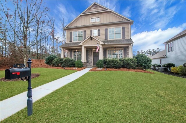 1803 Stone Bridge Way, Marietta, GA 30064 - craftsman-style home with brick siding, board and batten siding, central AC, and a front lawn