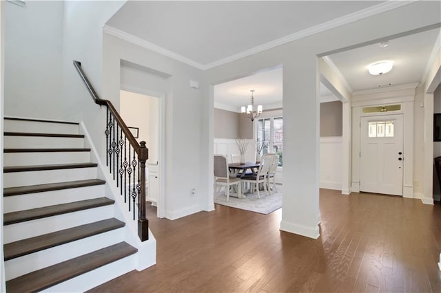 1803 Stone Bridge Way, Marietta, GA 30064 - entrance foyer with a notable chandelier, dark wood-type flooring, crown molding, and stairway