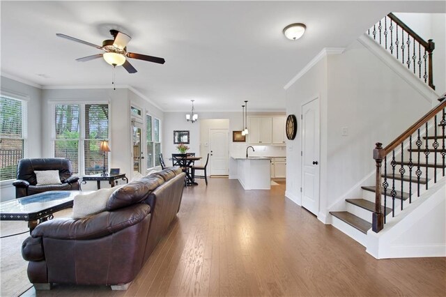 1803 Stone Bridge Way, Marietta, GA 30064 - living area with wood finished floors, ceiling fan, stairs, and ornamental molding
