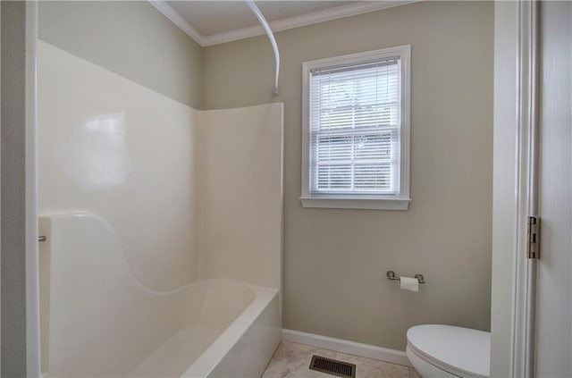 bathroom with toilet, bathing tub / shower combination, tile patterned floors, and ornamental molding