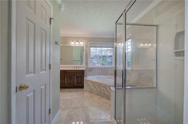 bathroom with vanity, a textured ceiling, separate shower and tub, and ornamental molding