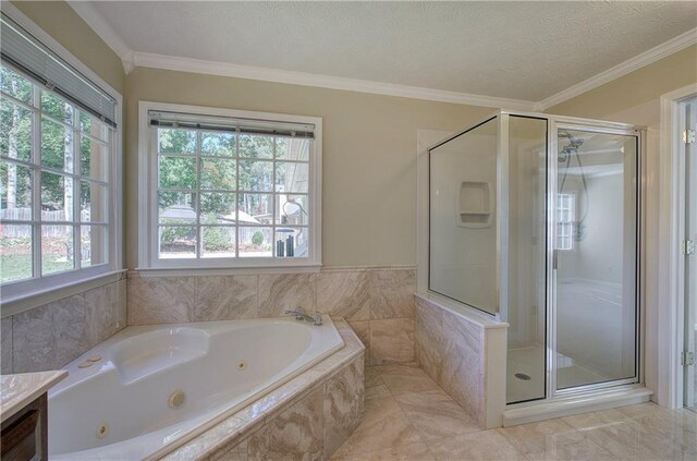 bathroom with plus walk in shower, vanity, crown molding, and a healthy amount of sunlight